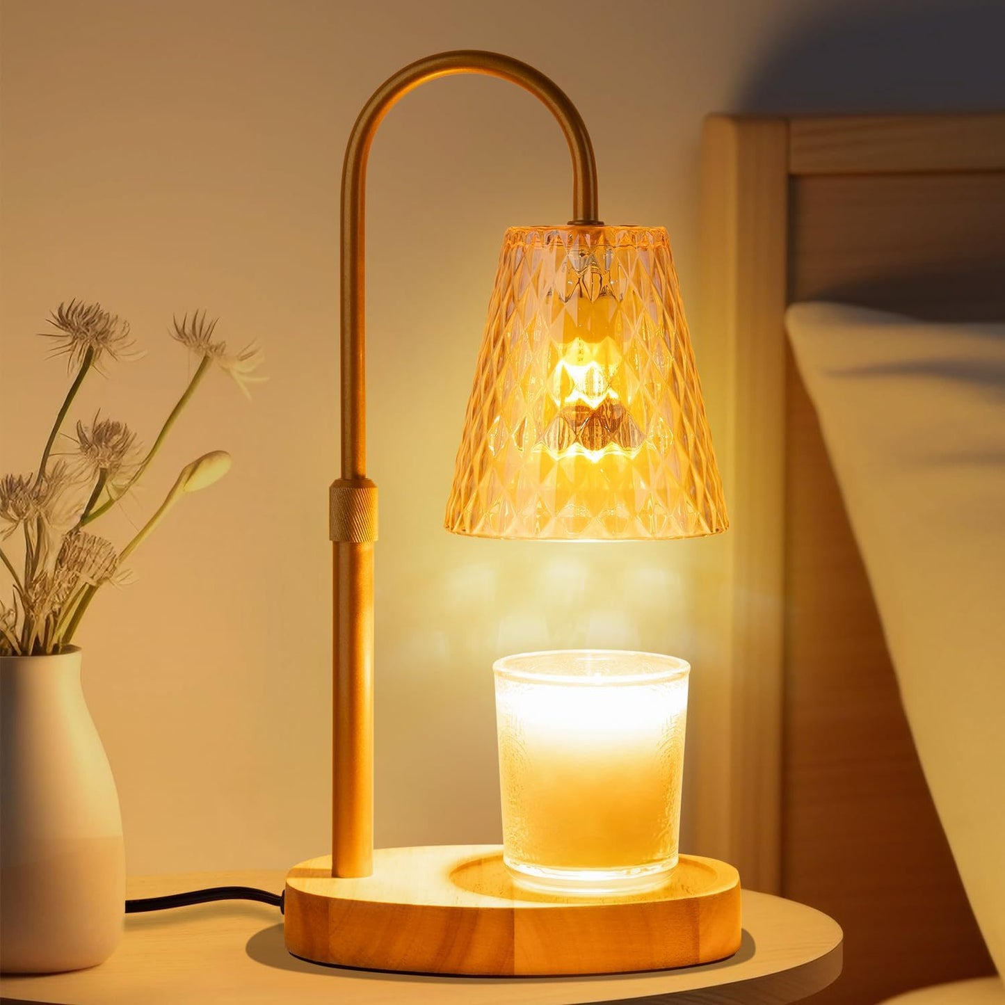 Dimmable adjustable height table lamp with amber glass shade glowing warmly