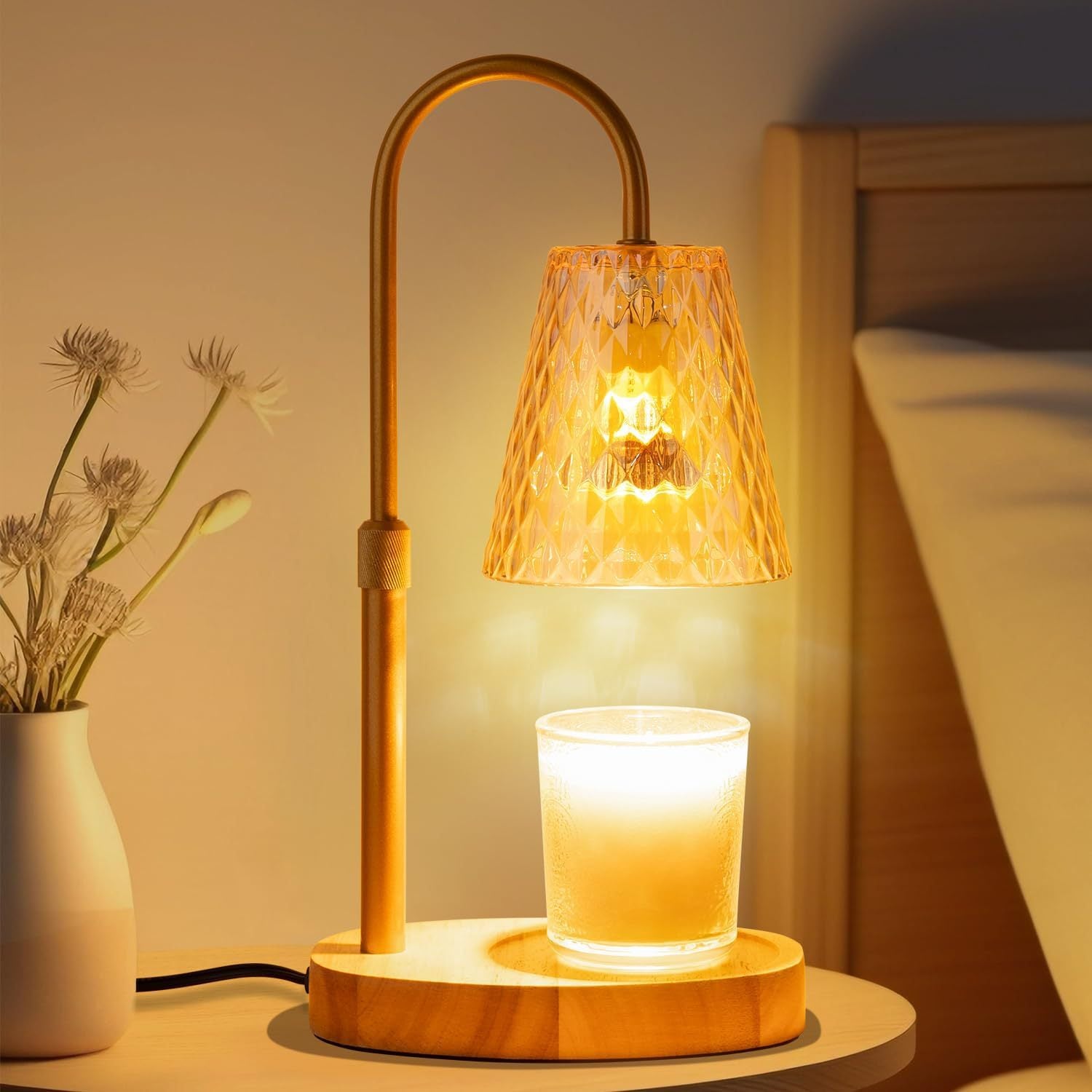 Dimmable adjustable height table lamp with amber glass shade glowing warmly
